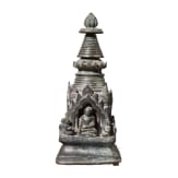 Bronze votive stupa with a reliquary chamber and depictions of Shakyamuni Buddha, flanked by two worshippers. Pagan Kingdom (Myanmar), 12th &ndash; 13th centuries.