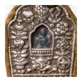 A Tibetan ritual bowl (kapala) and a small travelling altar (Gau), 20th century