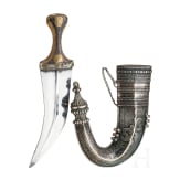 A Yemenite silver-mounted jambiya with rhino horn grip, dated 1942