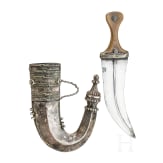 A Yemenite silver-mounted jambiya with rhino horn grip, dated 1942