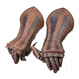 A pair of German black-and-white armoured gauntlets retaining their authentic Leather lining, ca. 1580