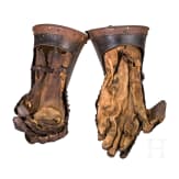 A pair of German black-and-white armoured gauntlets retaining their authentic Leather lining, ca. 1580