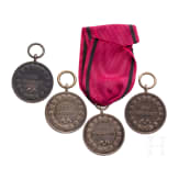 Four silver King Karl Civil Service Medals