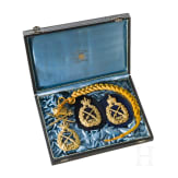 A Imperial Shooting Cord and three Imperial Shooting Badges, dated 1909 and 1910