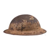 A MK I &ldquo;Brodie&rdquo; steel helmet, an early production model with an additional rail for the face guard
