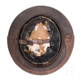 A MK I &ldquo;Brodie&rdquo; steel helmet, an early production model with an additional rail for the face guard