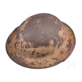 A MK I &ldquo;Brodie&rdquo; steel helmet, an early production model with an additional rail for the face guard