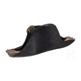 A bicorne hat and a pair of epaulettes for naval officers, circa 1900