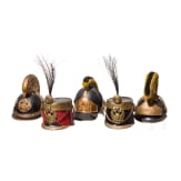 Five Austrian miniature helmets (ball donations), second half of the 20th century