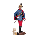 A miniature figure of an officer in the Austro-Hungarian Uhlan Regiment No. 5 and a miniature helmet, 20th century