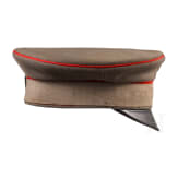 A field-grey visor cap for officers of the Prussian army with camouflage ribbon