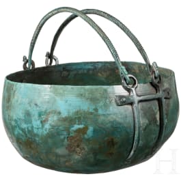 A Central European bronze cauldron with attachments for crossed handles, Hallstatt period, 8th century B.C.