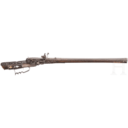 A southern German carved wheellock rifle with mother-of-pearl inlays in the style of the Maucher family of Schw&auml;bisch-Gm&uuml;nd, late 17th century