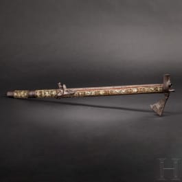 A Silesian battle axe with integrated flintlock and dagger, circa 1700