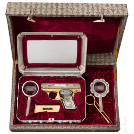 A cased Norinco M 84 in gold finish