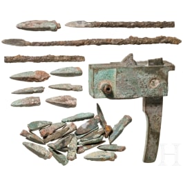 A Chinese crossbow lock and a collection of 29 arrow heads, Han dynasty, 206 B.C. – 220 A.D.