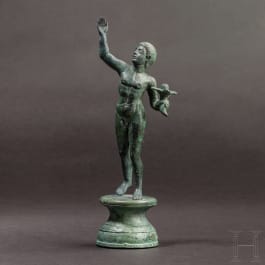 A graceful Roman bronze figure of a victorious athlete, 2nd century