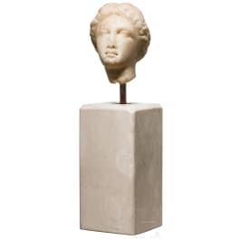 A Roman marble head of a female goddess, after Greek model, 1st century