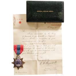 Great Britain - an Imperial Service Medal with document, dated 1913