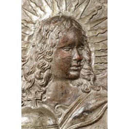 A pair of South German silvered metal panels showing Jesus and Mary, circa 1700