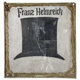 A German hatter's shop sign, dated 1877