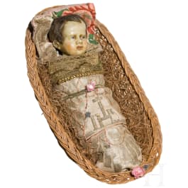 A South German swaddled baby in a basket, 19th century