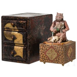 A small Japanese box with drawers and a figurine of an oni, Meiji period