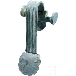A Greek bronze vessel handle, 5th century B.C.