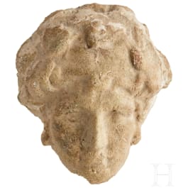 A Greek-Hellenistic terracotta head of Heracles, 3rd - 2nd century B.C.