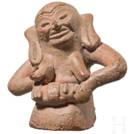 An exceptional Mexican terracotta figure of a nursing woman, Veracruz, 300 - 900 A.D.