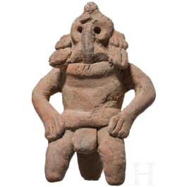 A Mexican terracotta figure of a shaman with mask, Veracruz, 300 - 900 A.D.
