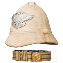 A pith helmet for members of the Imperial Navy and the protection forces in the colonies, circa 1900, and a belt buckle for a military doctor