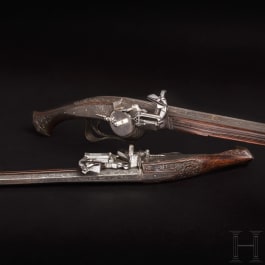 A pair of Viennese deluxe wheellock pistols, Master of the Animal-head Scroll, circa 1630/40