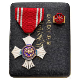 A Japanese Red Cross silver medal for women in box