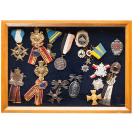 A collection of 16 early badges and awards from veteran associations, Prussia, Lippe and others