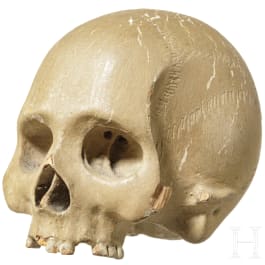 A German wooden Memento Mori skull, 17th century