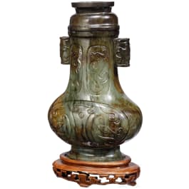 A Chinese jade vase in an archaic style, late Qing dynasty, 19th - early 20th century