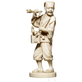 A Japanese Okomono of a toy peddler, 2nd half of the 19th century