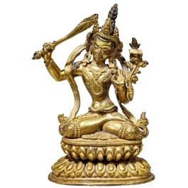 A gilded Tibetan bronze statue of Boddhisattva Mañjuśrī with sword, 18th century