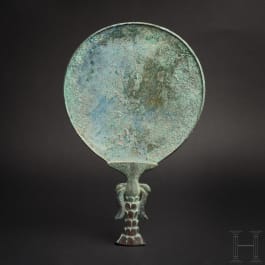 An Elamite-Sumerian bronze mirror, 2nd millennium B.C.