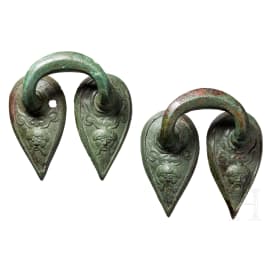 Two late archaic Greek handles, bronze, circa 500 B.C.