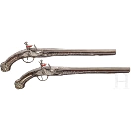 A pair of Ottoman silver-mounted oriental flintlock pistols, circa 1820/30
