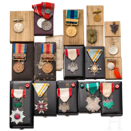 A group of 17 Japanese awards and medals with cases, Meiji and Showa period