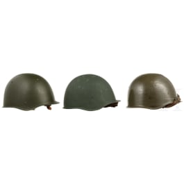 Four Soviet and Czechoslovak steel helmets and one tanker's cap