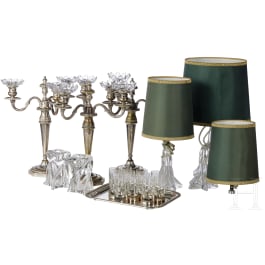 A French set of eleven liquor glasses and a small collection of candlesticks and lamps, 20th century