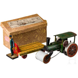 A small TippCo road roller and a luggage trolley in the original box from the August Stukenbrok department store
