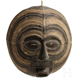 A round Congolese kifwebe mask of the Luba tribe