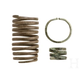 A Central European arm spiral, a bracelet and a hairband, Bronze Age, 1500 - 800 B.C.
