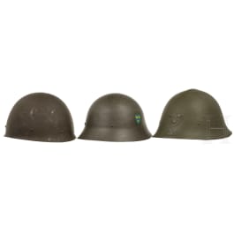 Three Swedish steel helmets