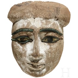 A charming Egyptian wooden mummy mask of a lady, 2nd half of the 2nd millennium B.C.